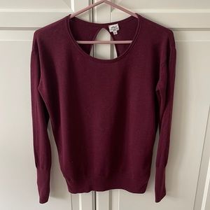 Wilfred sweater with open back.